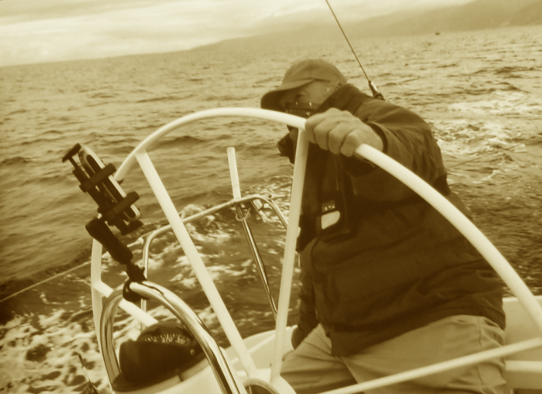 Chuck Spear at the helm of his J105